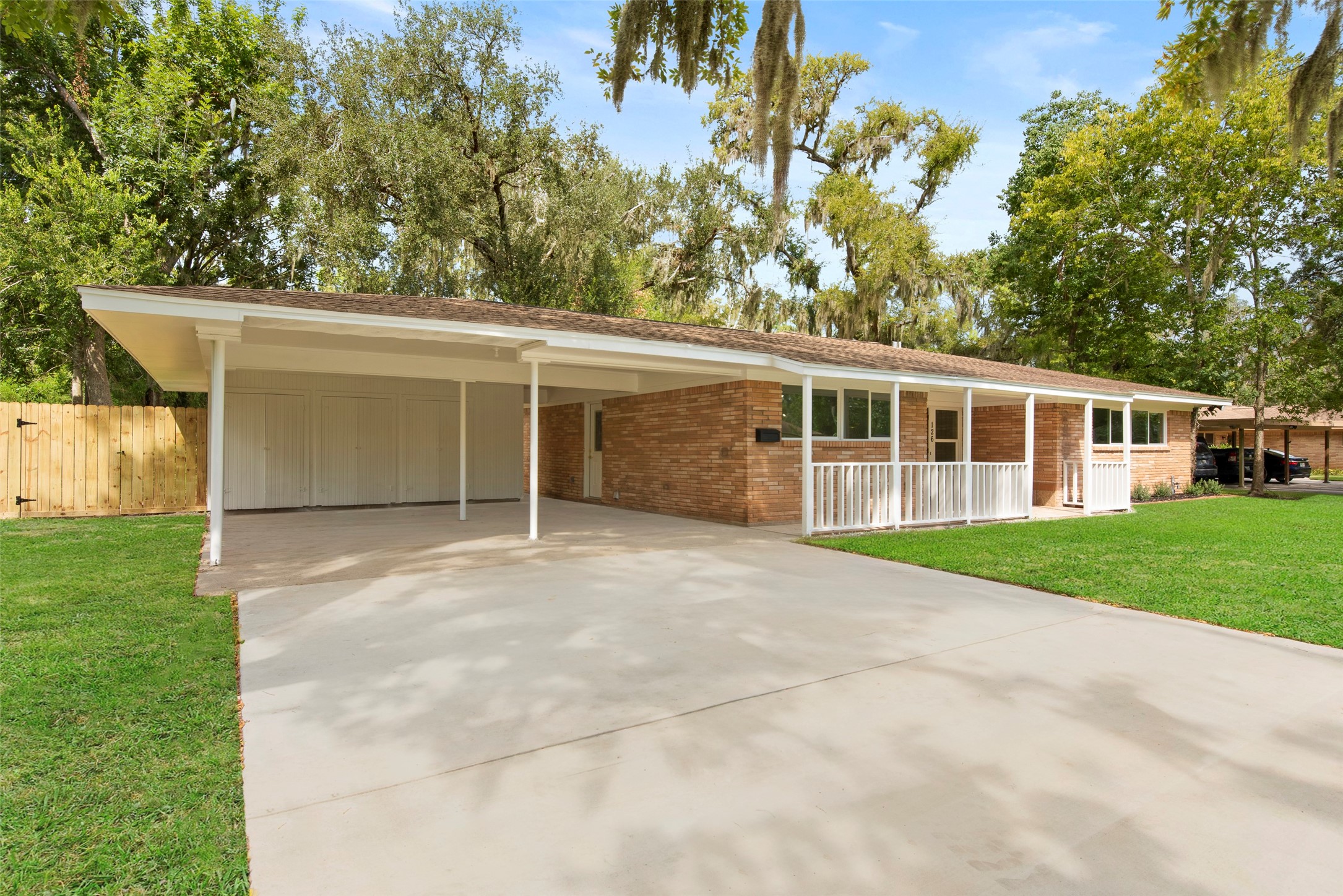 126 Daisy Street Lake Jackson, TX 77566 - Photo 31 of 36 front view of a house with a garden