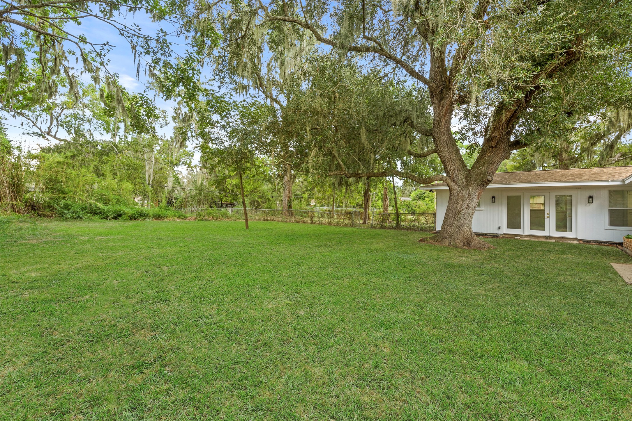 126 Daisy Street Lake Jackson, TX 77566 - Photo 34 of 36 a view of an house with backyard space and garden