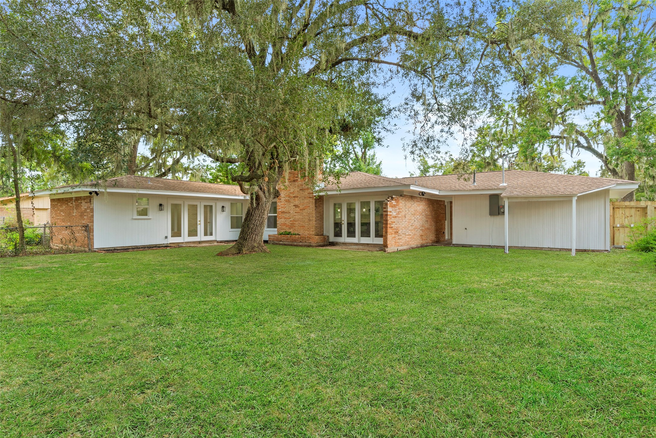 126 Daisy Street Lake Jackson, TX 77566 - Photo 35 of 36 a front view of a house with a garden