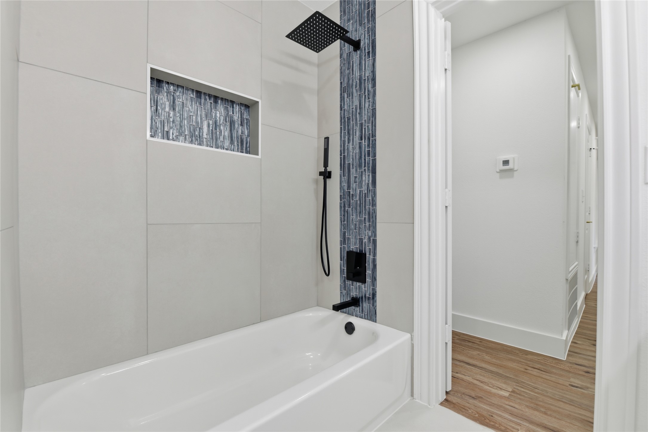 126 Daisy Street Lake Jackson, TX 77566 - Photo 36 of 36 a bathroom with a bathtub and shower