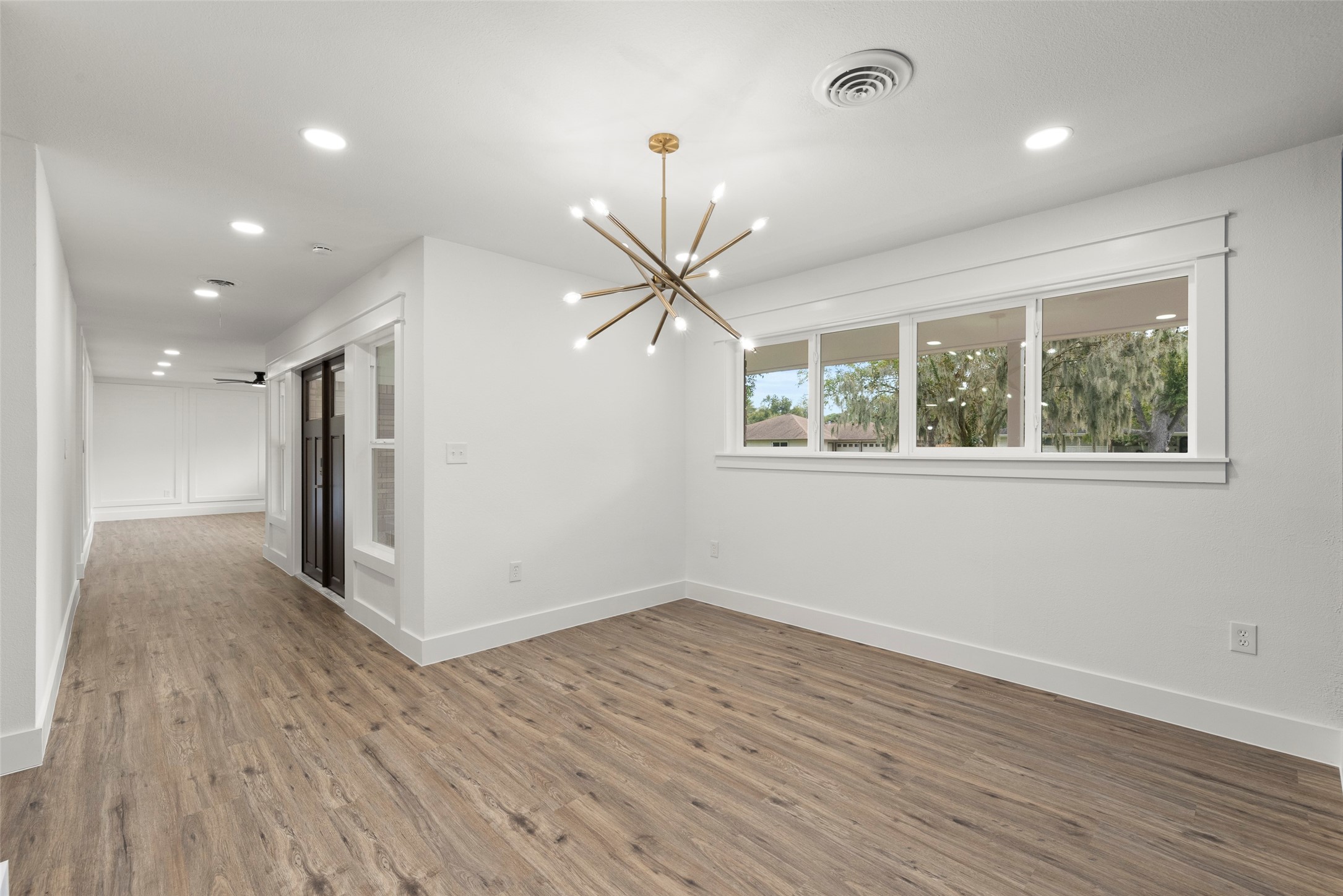 126 Daisy Street Lake Jackson, TX 77566 - Photo 7 of 36 a view of empty room with wooden floor and fan