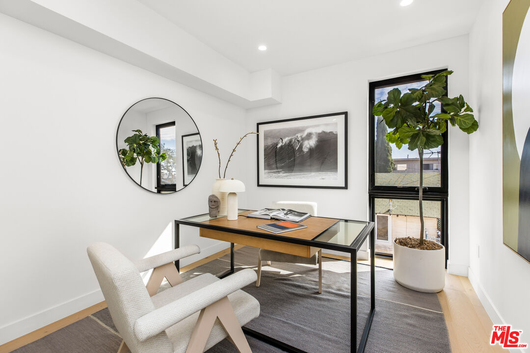 3808 College Avenue, Unit 2 Culver City, CA 90232 - Photo 11 of 15 a view of a dining room with furniture a potted plant and wooden floor