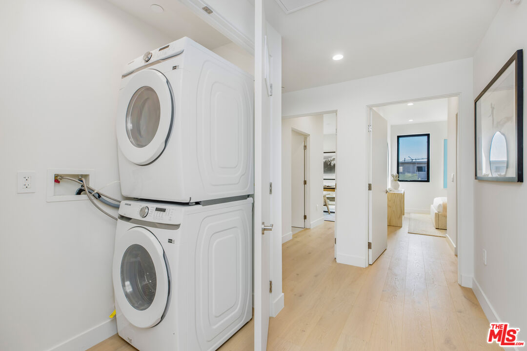 3808 College Avenue, Unit 2 Culver City, CA 90232 - Photo 13 of 15 a view of a hallway with washer and dryer