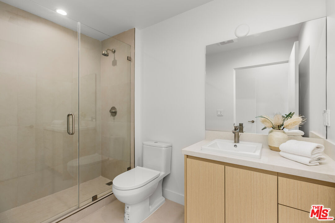 3808 College Avenue, Unit 2 Culver City, CA 90232 - Photo 10 of 15 a bathroom with a sink toilet and shower
