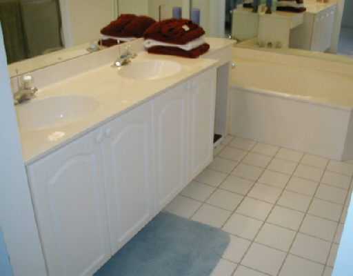 1154 Via Jardin, Unit 1154 Riviera Beach, FL 33418 - Photo 12 of 16 a utility room with a sink