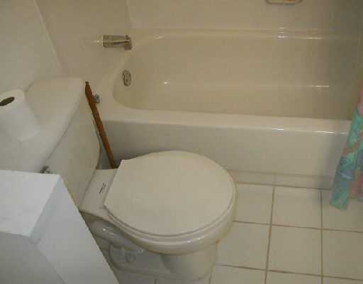1154 Via Jardin, Unit 1154 Riviera Beach, FL 33418 - Photo 15 of 16 a bathroom with a toilet and a bathtub