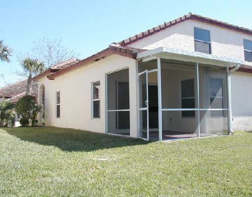 1154 Via Jardin, Unit 1154 Riviera Beach, FL 33418 - Photo 2 of 16 a view of a house with backyard and garden