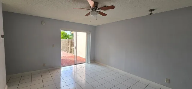 a view of an empty room and window