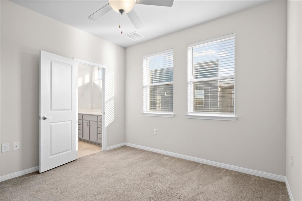 9015 Cattle Baron Path, Unit 705 Austin, TX 78747 - Photo 23 of 35 a view of an empty room with a window