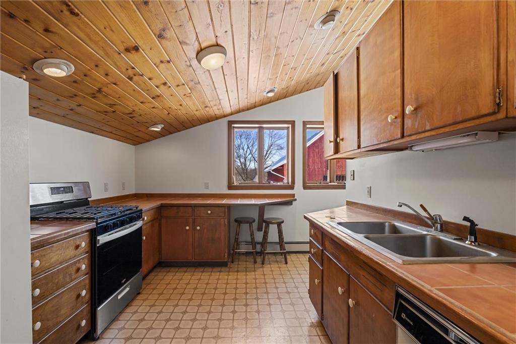 121 Brewer Road Saxonburg, PA 16056 - Photo 31 of 49 a kitchen with stainless steel appliances granite countertop a sink and cabinets