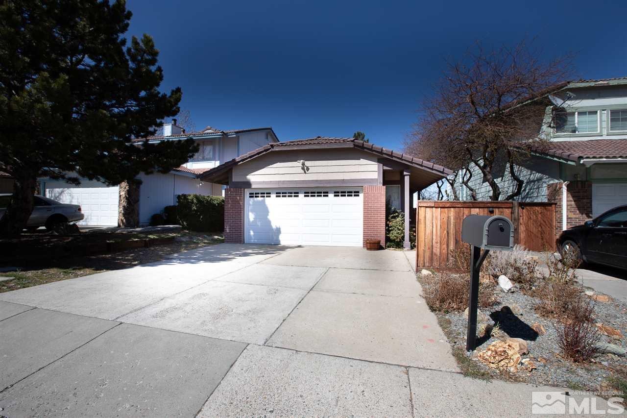 7015 Indigo Circle Reno, NV 89506 - Photo 1 of 12 a view of a house with a snow in the yard