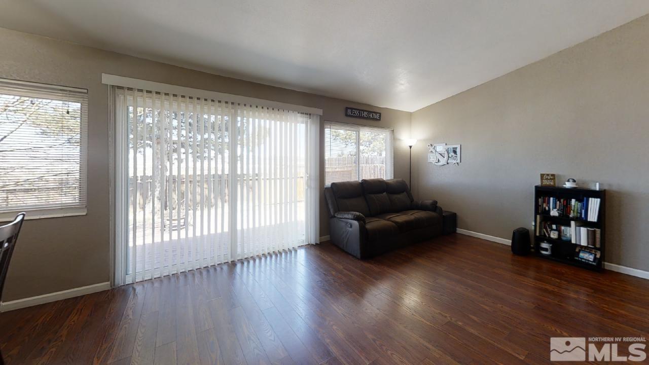 7015 Indigo Circle Reno, NV 89506 - Photo 4 of 12 a living room with furniture and a wooden floor