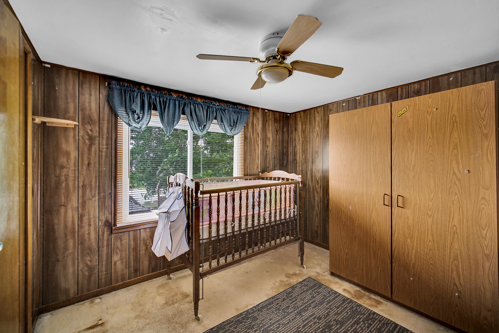 1453 Shell Street Hammond, IN 46320 - Photo 12 of 23 a bedroom with a bed and a chandelier