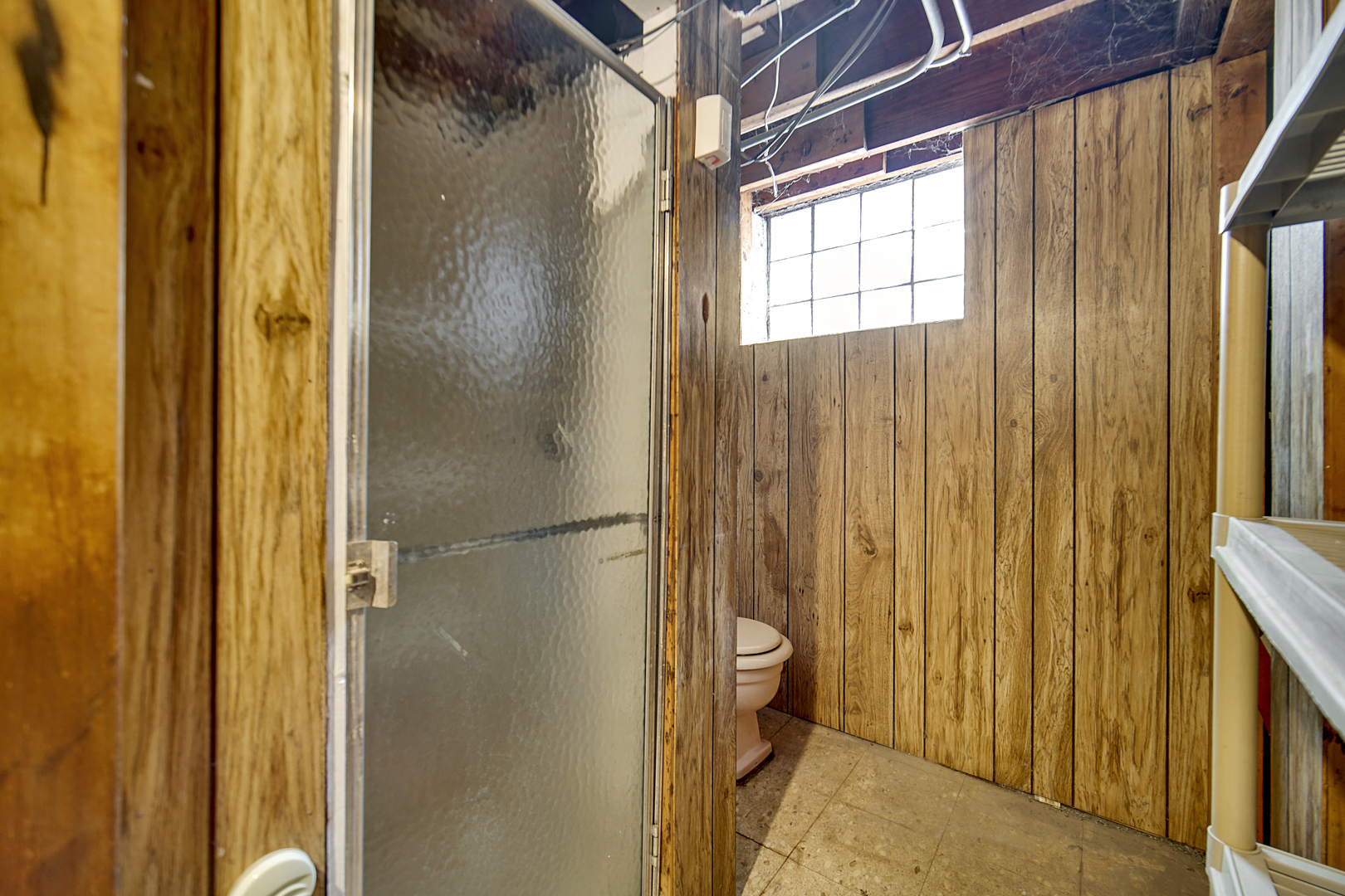 1453 Shell Street Hammond, IN 46320 - Photo 17 of 23 a bathroom with a glass door shower