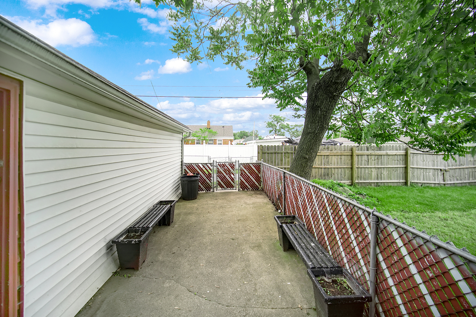 1453 Shell Street Hammond, IN 46320 - Photo 22 of 23 a view of a balcony with wooden floor and fence