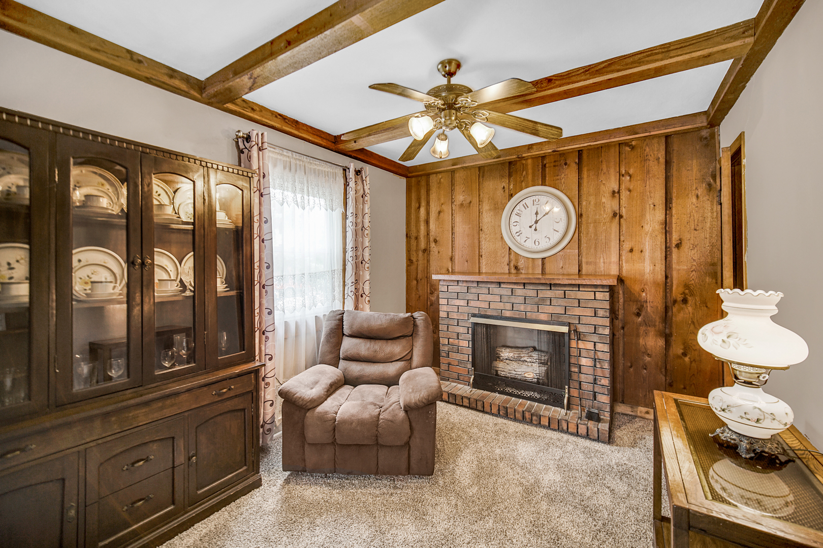 1453 Shell Street Hammond, IN 46320 - Photo 4 of 23 a living room with furniture a fireplace and a large window