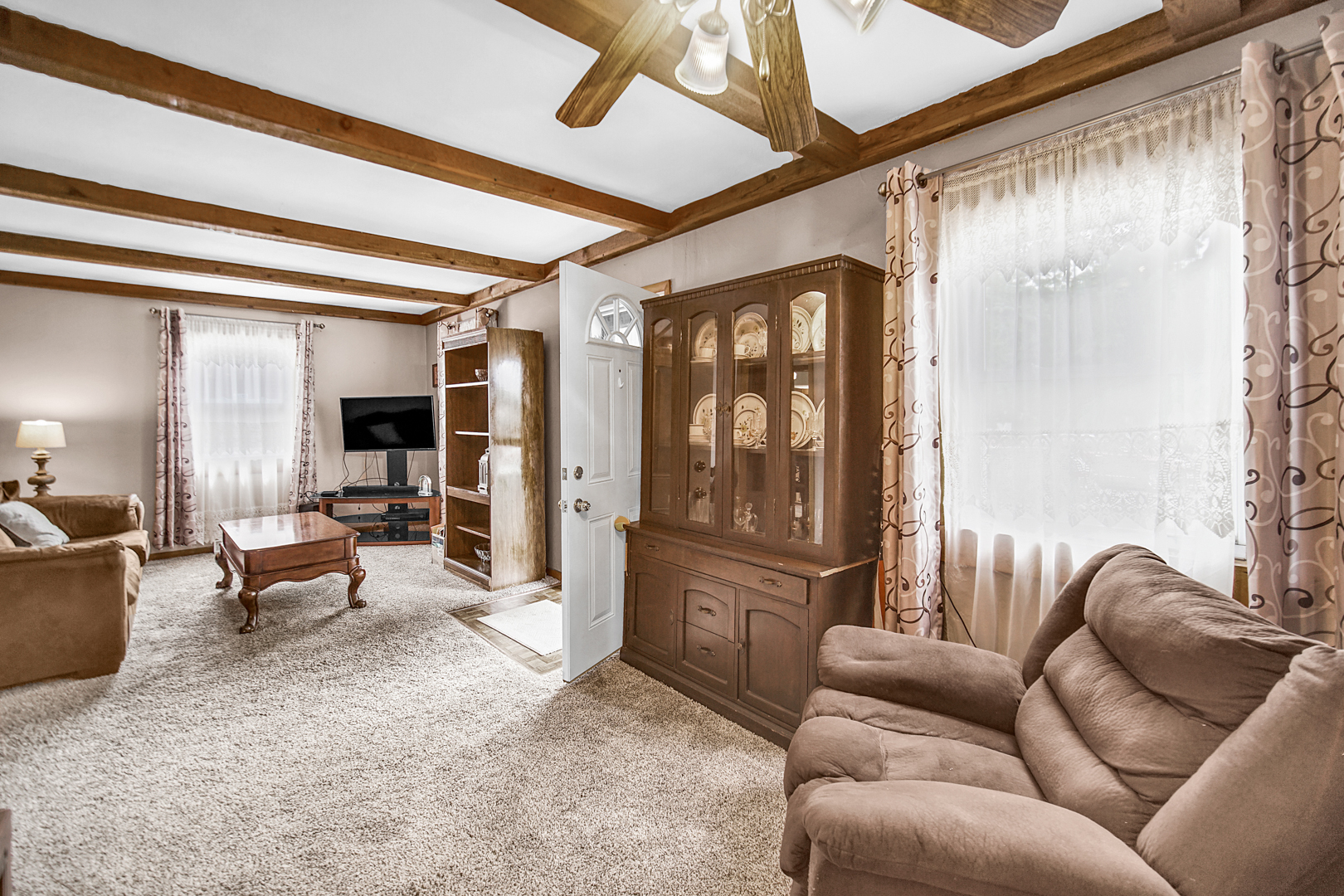 1453 Shell Street Hammond, IN 46320 - Photo 5 of 23 a living room with furniture and a floor to ceiling window