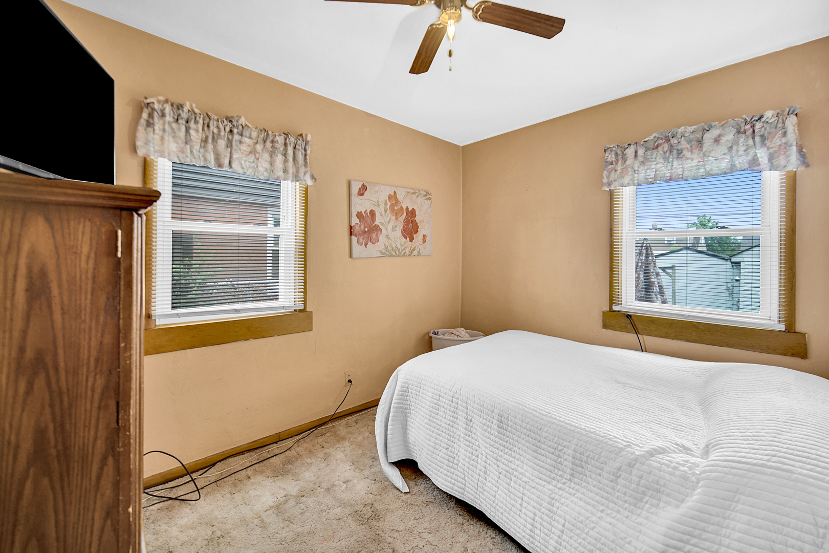 1453 Shell Street Hammond, IN 46320 - Photo 7 of 23 a bedroom with a bed and a flat screen tv