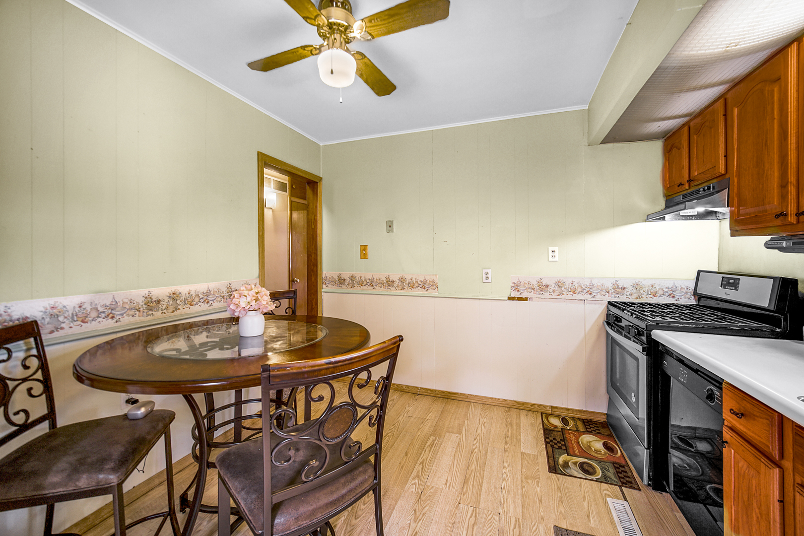 1453 Shell Street Hammond, IN 46320 - Photo 10 of 23 a kitchen with a table and chairs in it