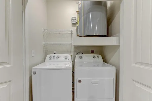 a bathroom with a granite countertop sink mirror toilet and bathtub
