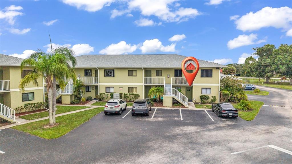 25225 Rampart Boulevard, Unit 1604 Punta Gorda, FL 33983 - Photo 30 of 41 a view of a street with chairs and a garage