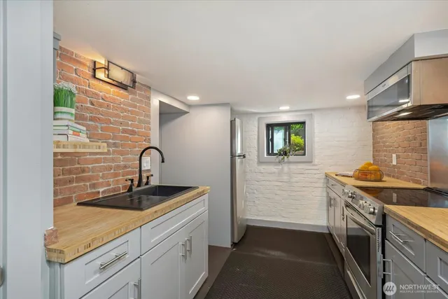 a kitchen that has a sink and a stove