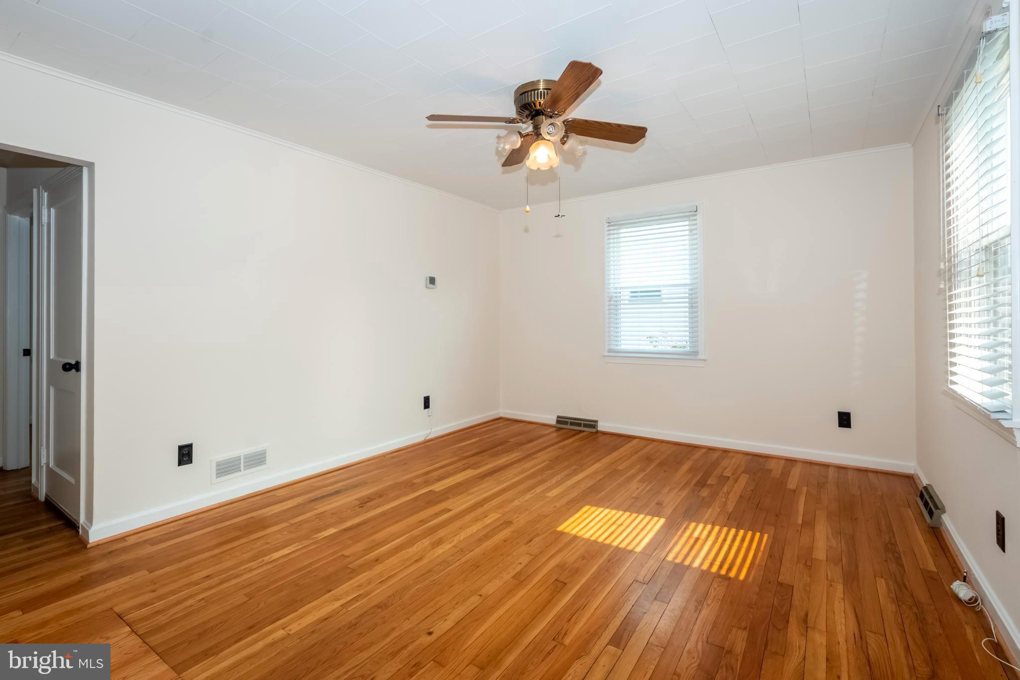 1720 Drexel Road Baltimore, MD 21222 - Photo 5 of 28 Living room with newly refinished hardwood