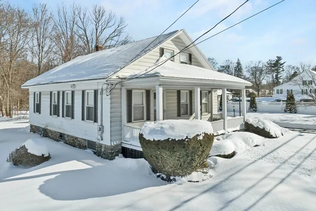 a front view of a house with a yard and porch