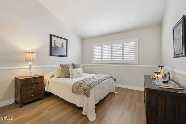 a bedroom with a bed and dresser