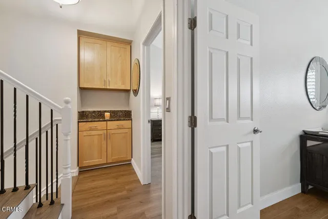 a view of hallway with kitchen view and living room view