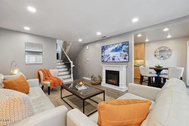 a living room with furniture and a fireplace