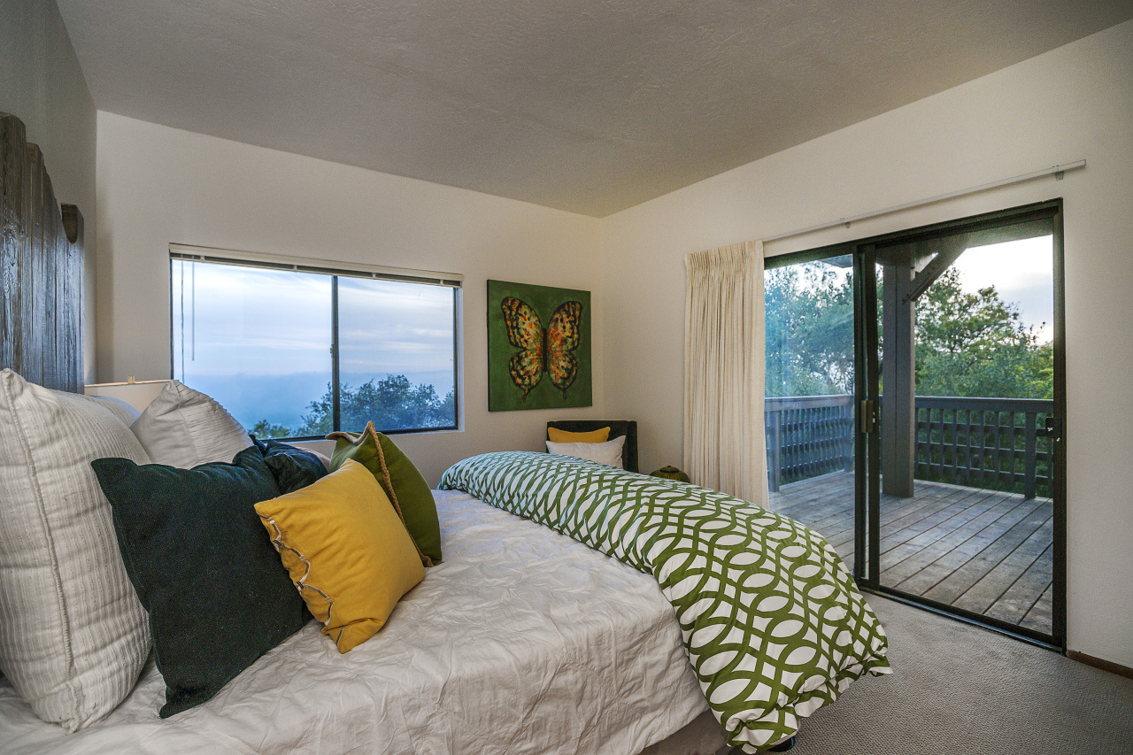 1500 Franceschi Road Santa Barbara, CA 93103 - Photo 11 of 18 a bedroom with a bed and glass door