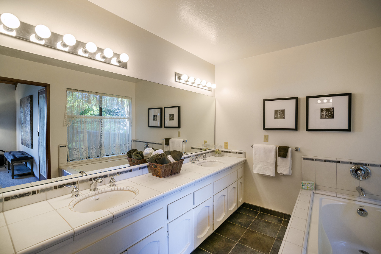 1500 Franceschi Road Santa Barbara, CA 93103 - Photo 8 of 18 a spacious bathroom with a double vanity sink a mirror a and a window