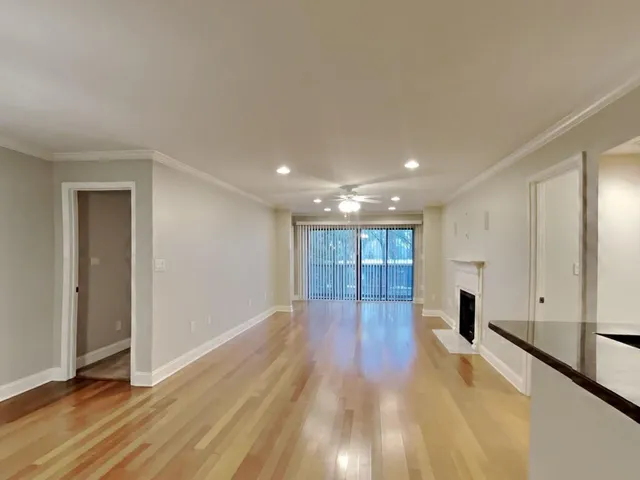 a view of a livingroom with wooden floor