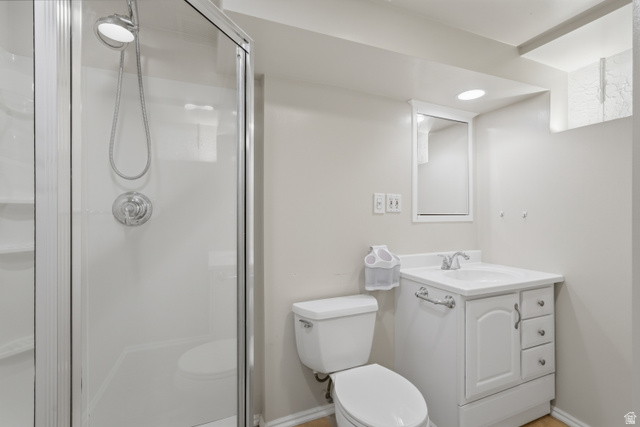 378 West 200 South Bountiful, UT 84010 - Photo 23 of 32 Three-piece bathroom featuring a glass-enclosed shower with a handheld showerhead, a white vanity with integrated sink and storage, and an illuminated medicine cabinet