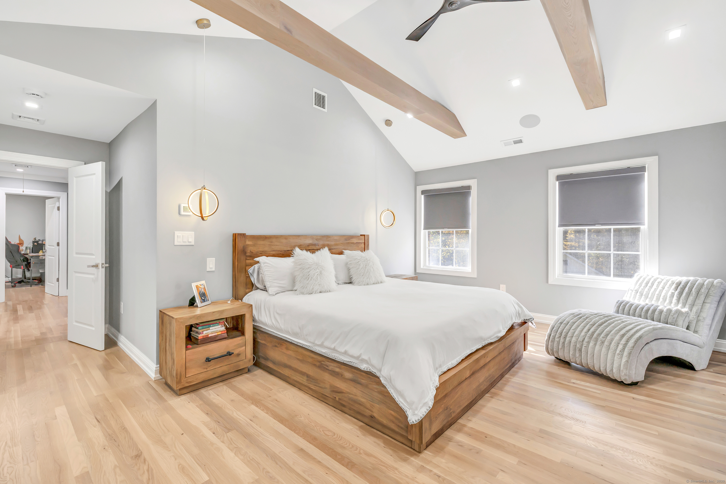 6680 Main Street Trumbull, CT 06611 - Photo 19 of 40 a spacious bedroom with a bed and a large window