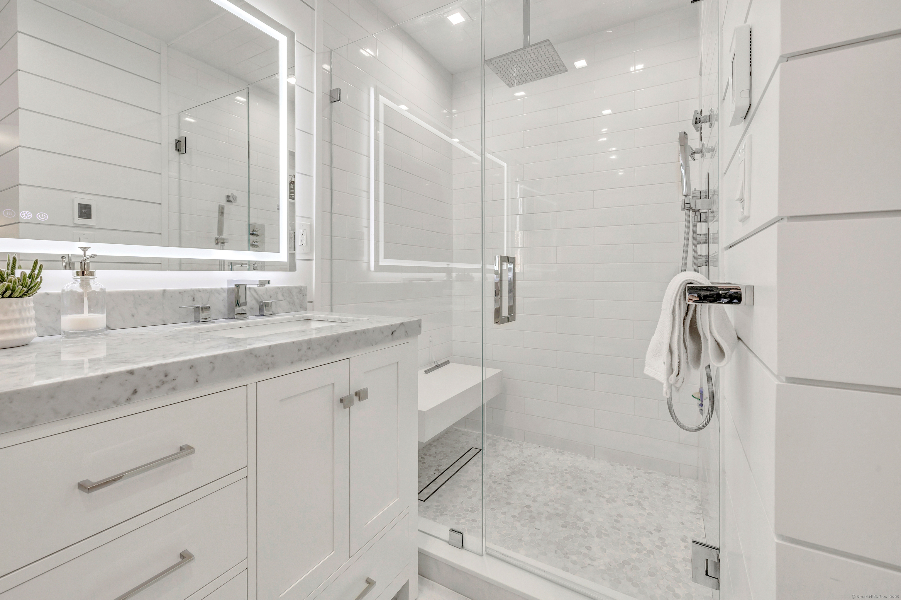 6680 Main Street Trumbull, CT 06611 - Photo 22 of 40 a bathroom with a granite countertop sink a toilet a shower and vanity