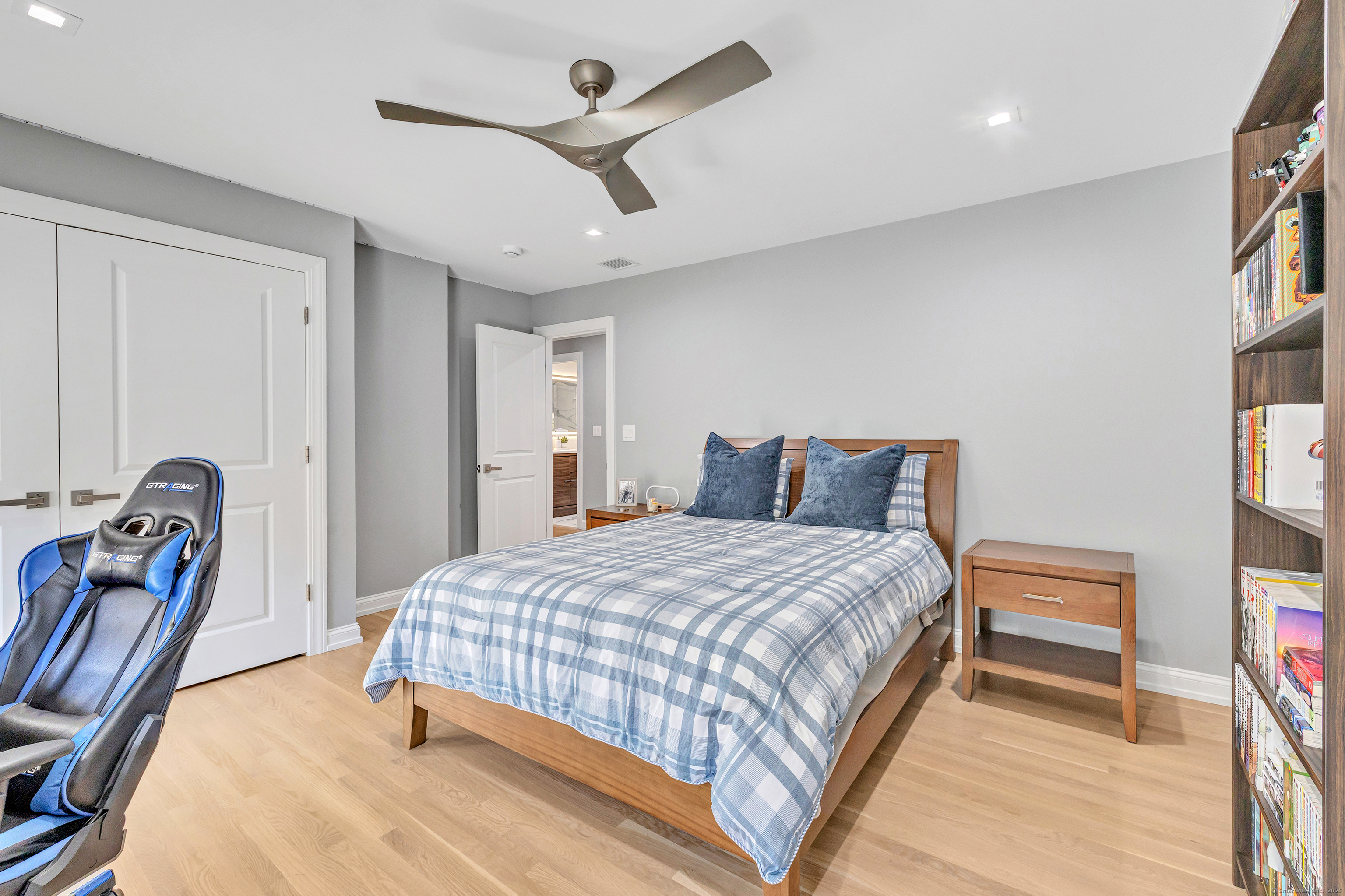 6680 Main Street Trumbull, CT 06611 - Photo 24 of 40 a bedroom with a bed and a chandelier