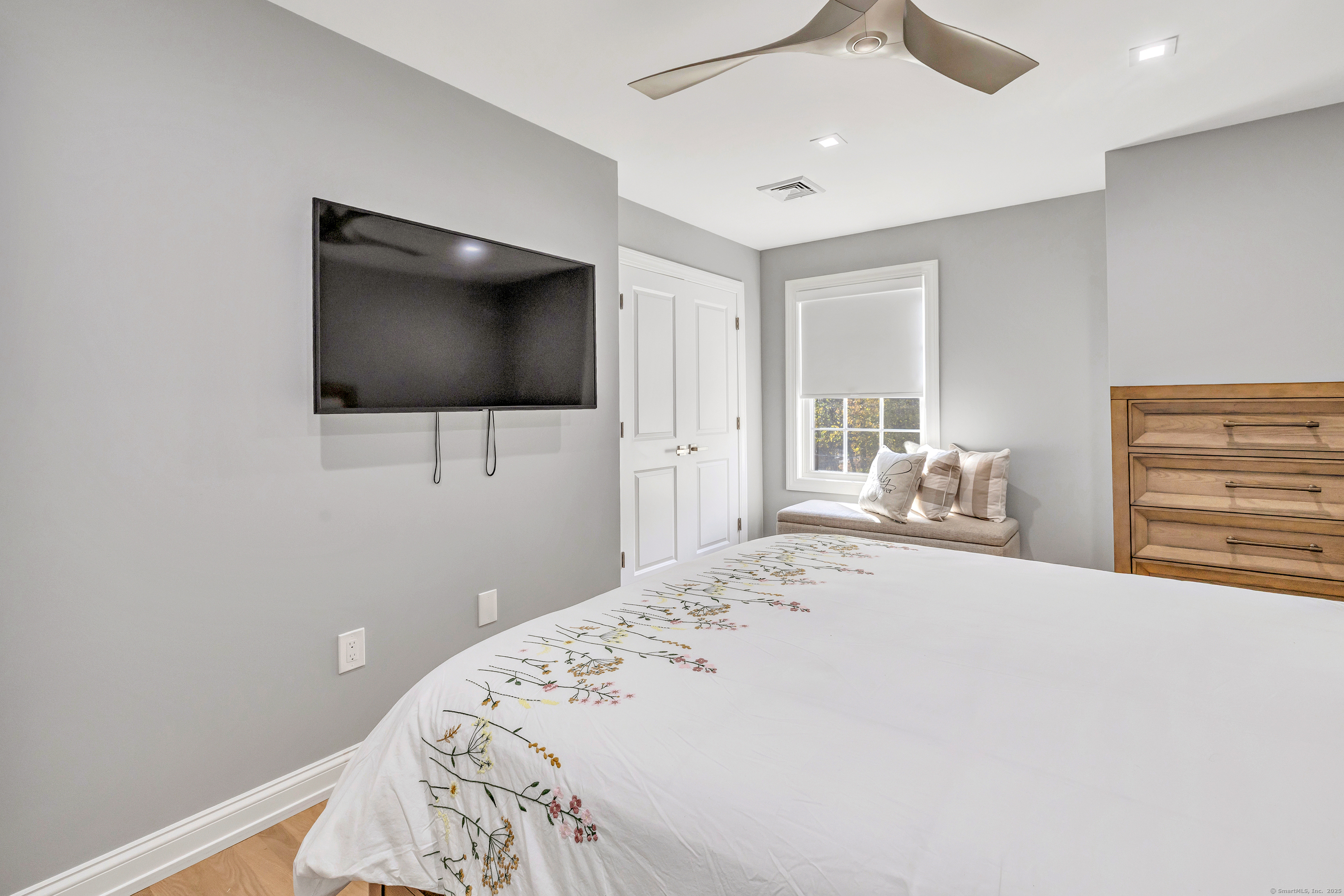 6680 Main Street Trumbull, CT 06611 - Photo 26 of 40 a bedroom with a bed and a flat screen tv