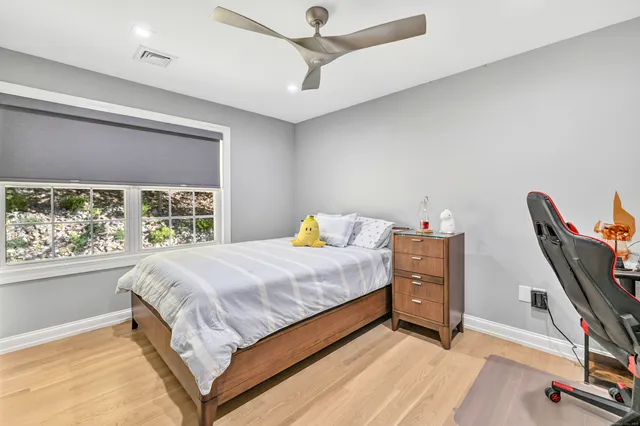 a bed room with a bed and a window