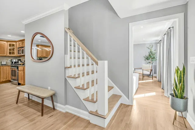 a view of a hallway to a livingroom and furniture