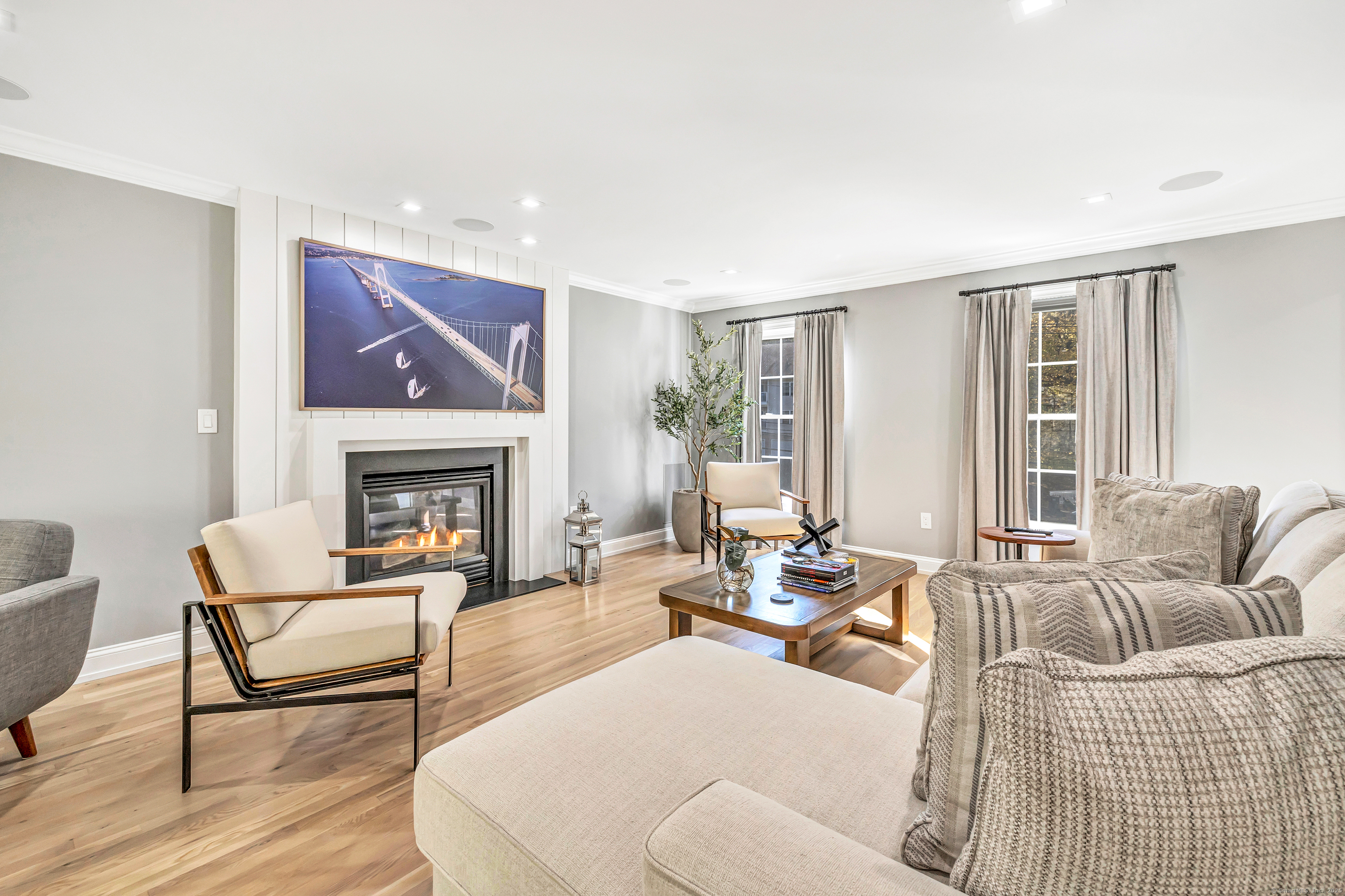 6680 Main Street Trumbull, CT 06611 - Photo 5 of 40 a living room with furniture and a fireplace