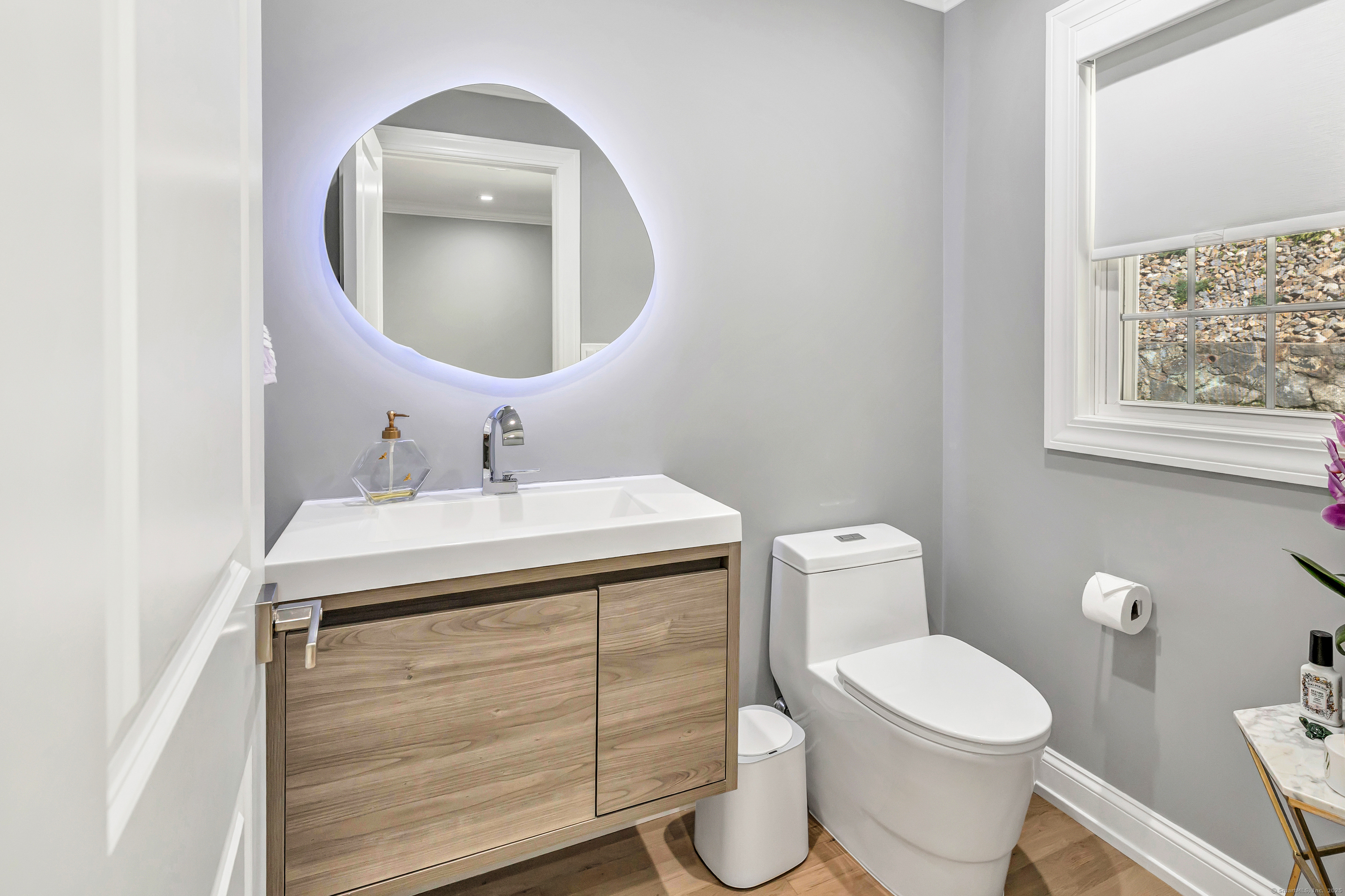 6680 Main Street Trumbull, CT 06611 - Photo 8 of 40 a bathroom with a toilet sink and mirror