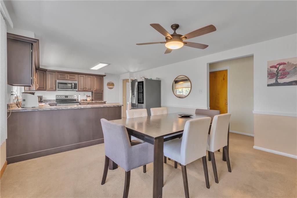 602 Circle Drive Rochester, PA 15074 - Photo 8 of 28 a dining room with granite countertop a table and chairs