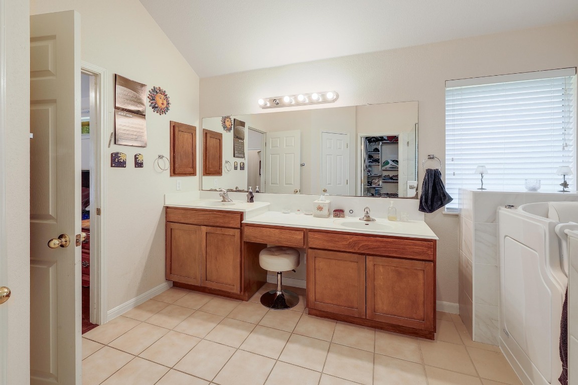 210 Buoy Circle Georgetown, TX 78633 - Photo 16 of 32 a bathroom with a sink and a mirror