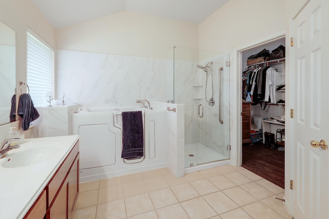 210 Buoy Circle Georgetown, TX 78633 - Photo 17 of 32 a bathroom with a sink and a shower