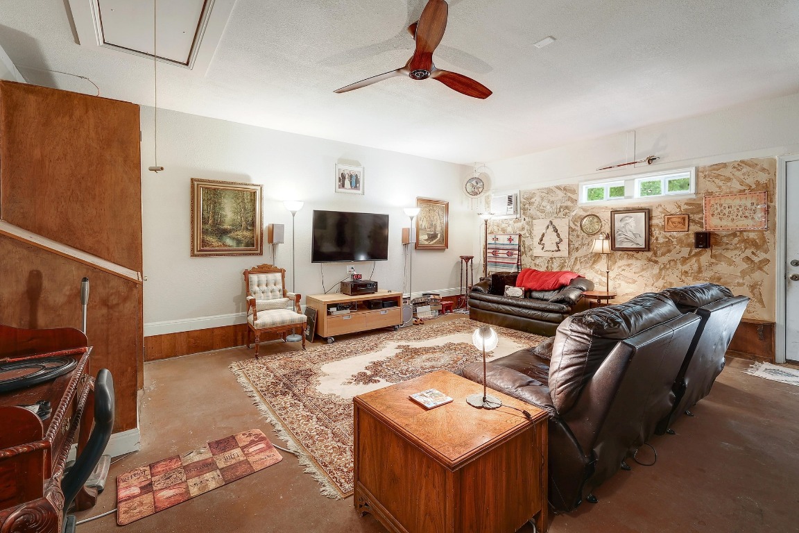 210 Buoy Circle Georgetown, TX 78633 - Photo 18 of 32 a living room with furniture and a flat screen tv