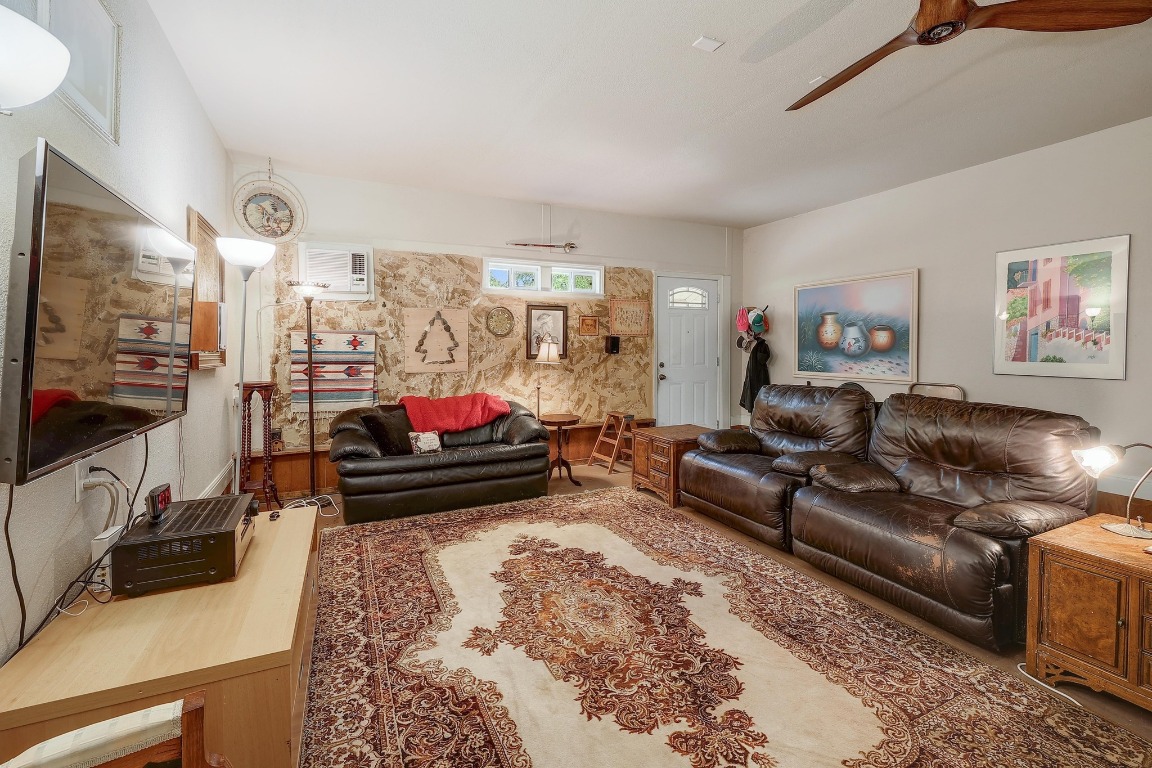 210 Buoy Circle Georgetown, TX 78633 - Photo 19 of 32 a living room with furniture and a flat screen tv