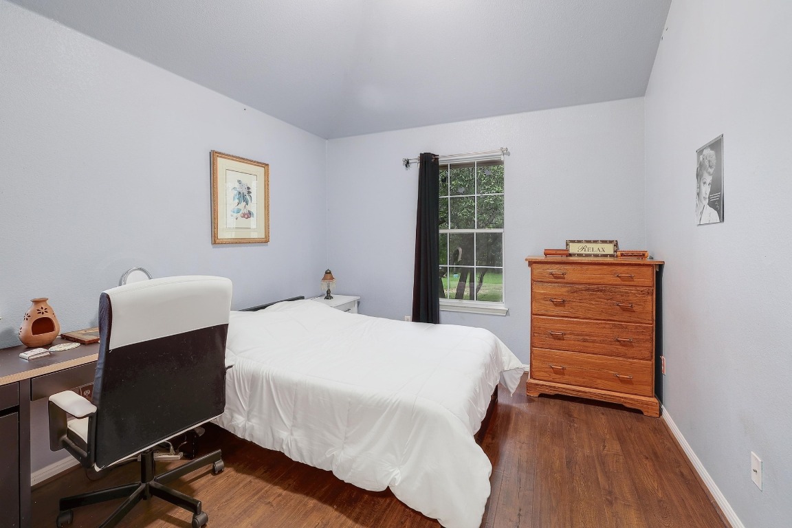 210 Buoy Circle Georgetown, TX 78633 - Photo 20 of 32 a bedroom with a bed and a desk