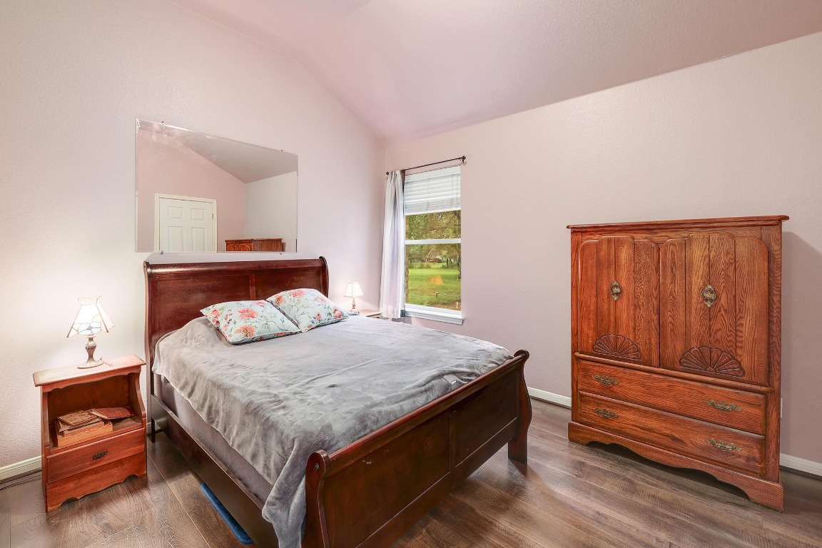 210 Buoy Circle Georgetown, TX 78633 - Photo 21 of 32 a bedroom with a bed and dresser